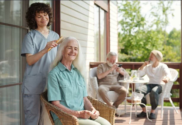 Support worker assisting an older person with personal care